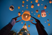 People Release Floating Lanterns Ballon To Blue Sky For Make A Wish For The Future, Thailand