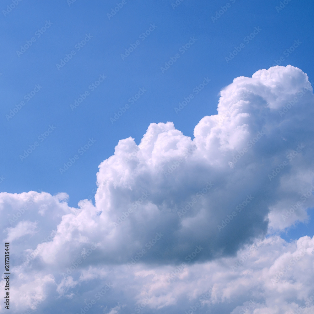 White fluffy clouds in the vast blue sky. Abstract nature background ...