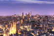 © kuremo - Aerial view of Ikebukuro skyscrapers illuminated in the night of Tokyo with tilt-shift bokeh in foreground.