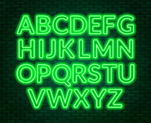 Neon Green Alphabet On Brick Wall Background. Capital Letter.