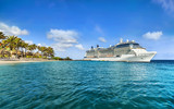 Fototapeta Big Ben - Cruise ship docked at tropical island on sunny day