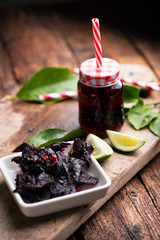 Sticker - Beef Jerky on wooden background with a soft drink