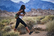 © Joshua Resnick - fit african american woman hiking through alabama hills park in california