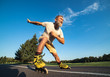 © Artem - The old man rollerblading on the road