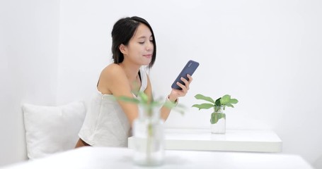 Sticker - Woman use of mobile phone in coffee shop