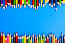 Colored Pencils Background.Color Pencils On Blue Background.Close Up. Many Different Colored Pencils On Blue Background.Colorful Pencil .Colorfull