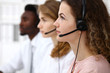 © rogerphoto - Call center operator.Young beautiful  brunette woman in headset. Business concept