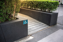 Ramped Access, Using Wheelchair Ramp With Information Sign On Floor Background