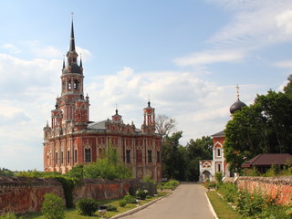 Russia, Mozhaisk Kremlin, region landmark on a summer day against the blue sky with clouds – medieval architecture, old buildings, view from main entrance