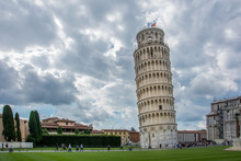 The Leaning Tower Of Pisa, Italy, With The Dramatic Sky. The Tower, Located On Piazza Dei Miracoli And Famous For Its Tilt, Is One Of The Iconic Landmarks Of Italy