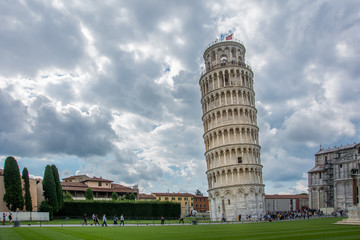 The Leaning Tower of Pisa, Italy, with the dramatic sky. The tower, located on Piazza dei Miracoli and famous for its tilt, is one of the iconic landmarks of Italy