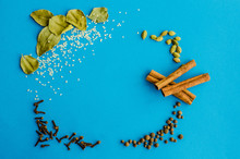 Many Spices On A Blue Background With Place Under The Text