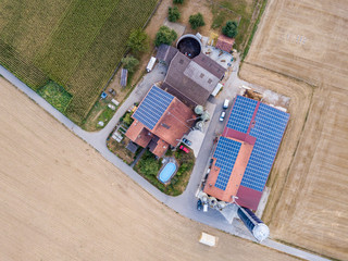 Wall Mural - Aerial view of farm with photovoltaics on roof in Switzerland