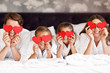 © Kalim - Happy family relaxing in hotel room