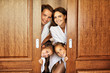 © Kalim - Happy family relaxing in hotel room
