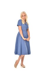 Poster - full length portrait of blonde girl wearing blue dress. standing pose. isolated on white  studio background.