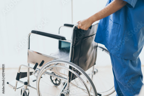 Nurse Is Takecare Wheel Chair For Old Senior Disable Health