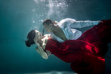 Couple Swimming Underwater