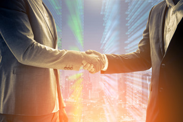 Wall Mural - two business men shaking hands during a meeting to deal complete agreement contract and become a business join venture success creativity ideas concept