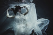 © oneinchpunch - Woman underwater