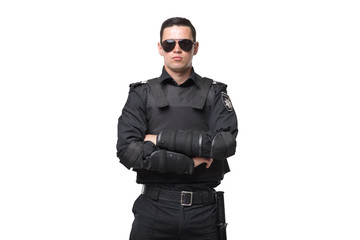 seriuse cop in sunglasses, uniform with body armor