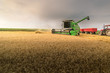 © Dusan Kostic - Pouring  grain into tractor trailer after harvest