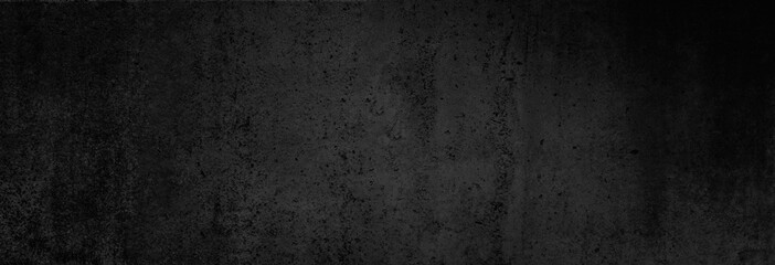 beton-textur in fast schwarz in xxl-größe als hintergrund, auf die betonwand fällt ganz leichtes lic