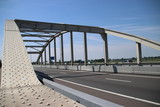 Fototapeta Mosty linowy / wiszący - Bridge over the railway tracks at Moordrecht in motorway A20 in the Netherlands