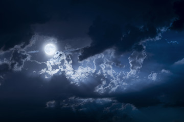 dramatic nighttime clouds and sky with beautiful full blue moon