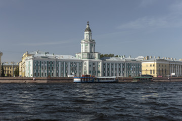 Wall Mural - Pleasure boats with tourists, float on the rivers and channels in a historical central Saint Petersburg.