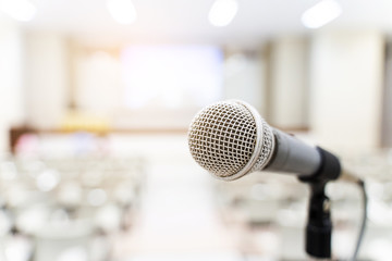 microphone over the blurred business forum meeting or conference training learning coaching room con