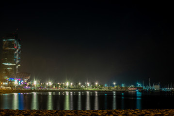 The long beach of Barcelona in summer at night - 1