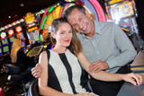 Fototapeta Tulipany - Portrait of couple in casino