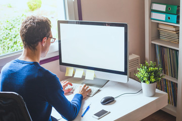 business man working on computer with empty blank screen in office workplace background