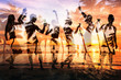 © Song_about_summer - beach party double exposure, group of young people dancing, friends drinking beer and cocktails at sunset