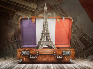 trip to paris. travel or tourism to france concept. eiffel tower andvintage suitcase with flag of fr