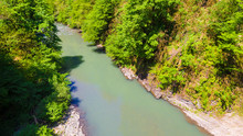 Drone View Of The Sochi River Gorge With Dense Forest In Sunny Summer Day, Russia
