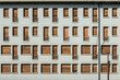 Concrete facade with series of facade of windows and small balconies