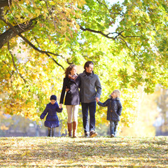 Wall Mural - Family with children in autumn park