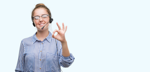 Sticker - Young blonde call center operator woman doing ok sign with fingers, excellent symbol