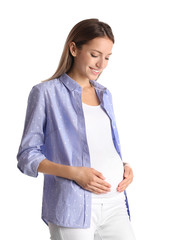 Poster - Happy pregnant woman touching her belly on white background