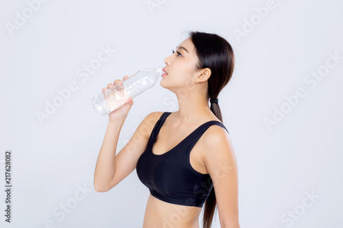 Fotomural Beautiful portrait asian young woman bottle of water for healthy isolated on white background, girl with fit thirsty after exercise and fitness, health concept
