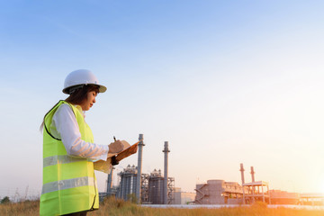 Wall Mural - Asia woman engineer working with check the information