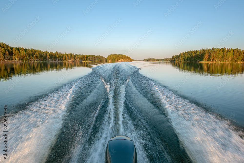 Trail on water surface behind of fast moving motor boat Stock Photo ...