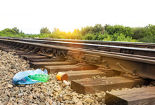 A Package With Garbage On The Railway Thrown Out From The Window Of The Train By Passengers, Pollution, Debris And The Railway, Litter