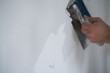 © GCapture - worker applying decorative concrete plaster on the wall