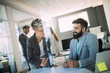 © NDABCREATIVITY - Picture of young architects discussing in office