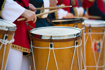 Group of Men Dressed in Medieval Clothes Playing Drums