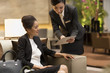 © Blue Jean Images - Professional service in luxury hotel
