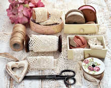 Vintage Style Still Life With Lace Trim Spools And Accessories